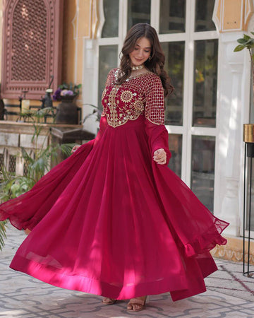 Rani pink color faux blooming georgette gown with embroidered dupatta