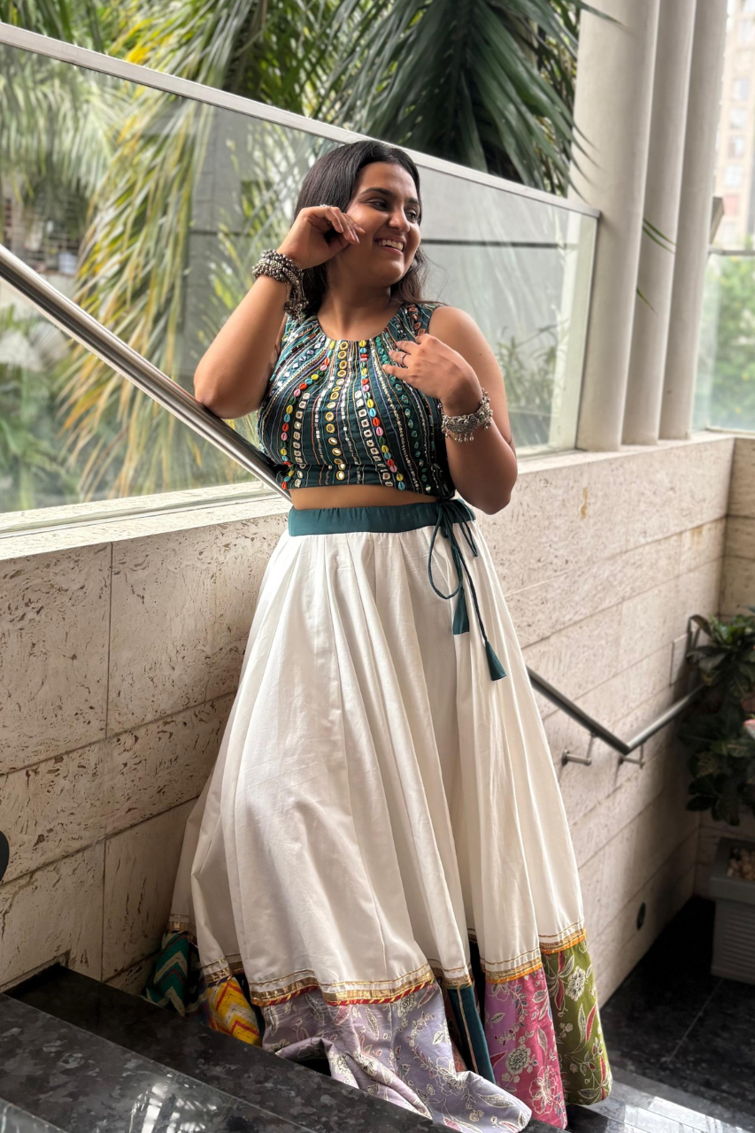 Paired with a soft, breezy white flared skirt