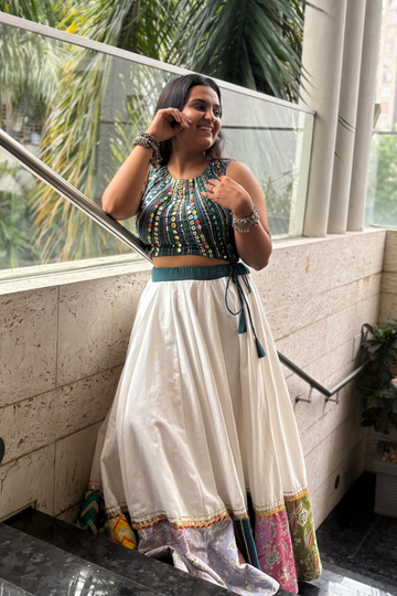 Paired with a soft, breezy white flared skirt